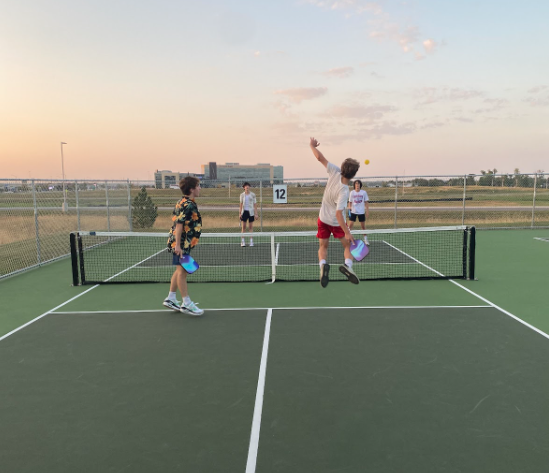 Action shot of pickleball players at Linda Erickson Pickleball Complex.