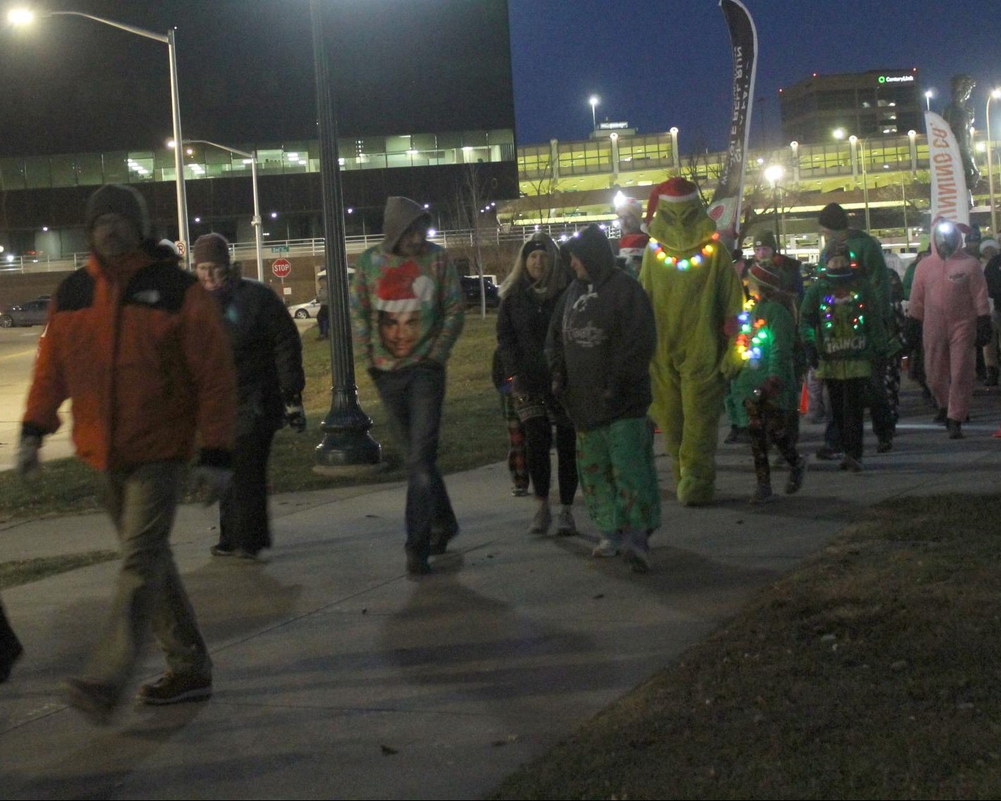 Walkers pass the start line at the annual Jingle Bell Run in downtown Sioux Falls.