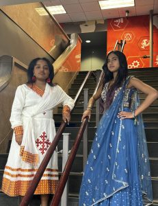 LHS junior Katya Surendran and LHS senior Shalom Kato wears their native cultures clothing (and attempts to be cool) before attending the LHS prom. Photo taken by Julie Cooper.