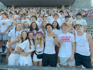 (Front row left to right) Seniors Olivia Shaefer, Josie Tollinger, Kinley Freese, Isaiah Teer, Dietrich Haan, Ryder Syverson, (Second row) Maddy Reents, Ava Klaahsen, Ella Rima, Kiley Stevenson, Nadiya Sanders, Lucy Pederson and Emma Murphy all gather in the front two rows of the student section to enjoy the football game.
