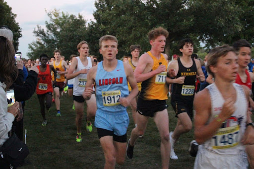 On Sep. 6, 2024, LHS senior Nathan Thompson sprinted and pushed his way through the last lap of the varsity boys group at the 2024 Augustana Twilight cross country meet with a surprised look on his face.