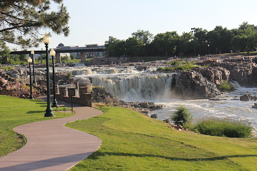 A sunny look at Falls Park, a defining yet accessible third place to many people located just north of downtown Sioux Falls. (Used with permission by Wikimedia Commons/Richard N Horne)