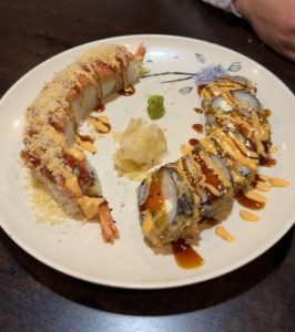 Sioux Falls Roll and Salmon Crab Stick Fried Roll topped with eel sauce and spicy mayo.