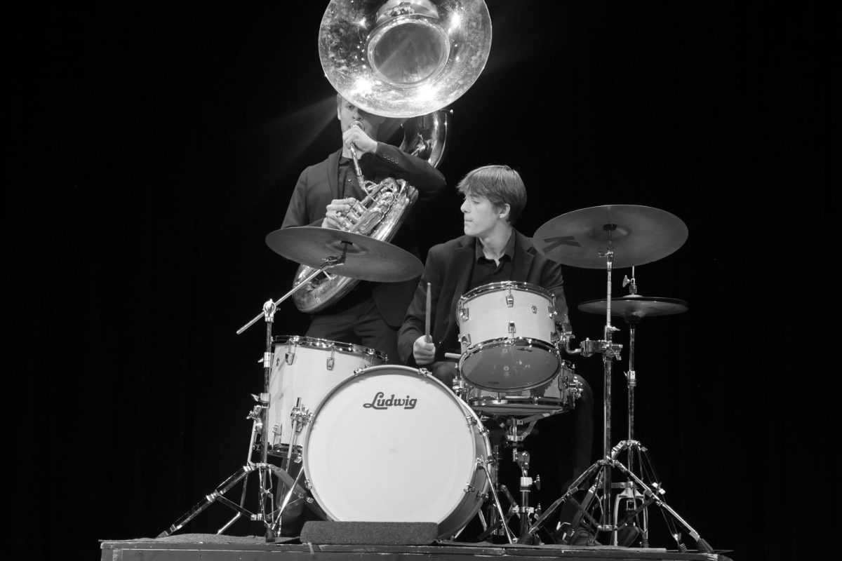 Post (left) and Burkett (right) performing for the LHS jazz band during the Homecoming variety show. (Photos used with permission by LHS Yearbook