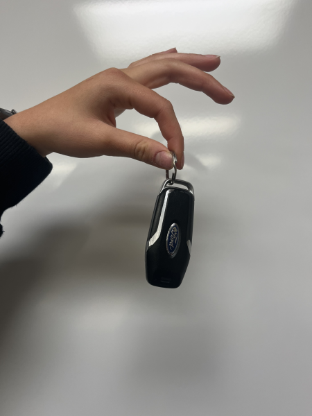 Junior Logan Sanborn holds her car keys, ready to drive in the winter weather.