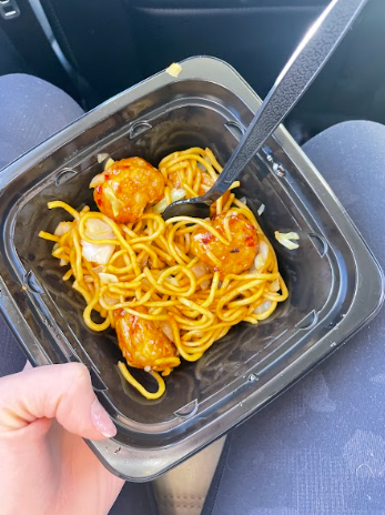 Panda Express's beyond orange chicken and chow mein in a to go box.