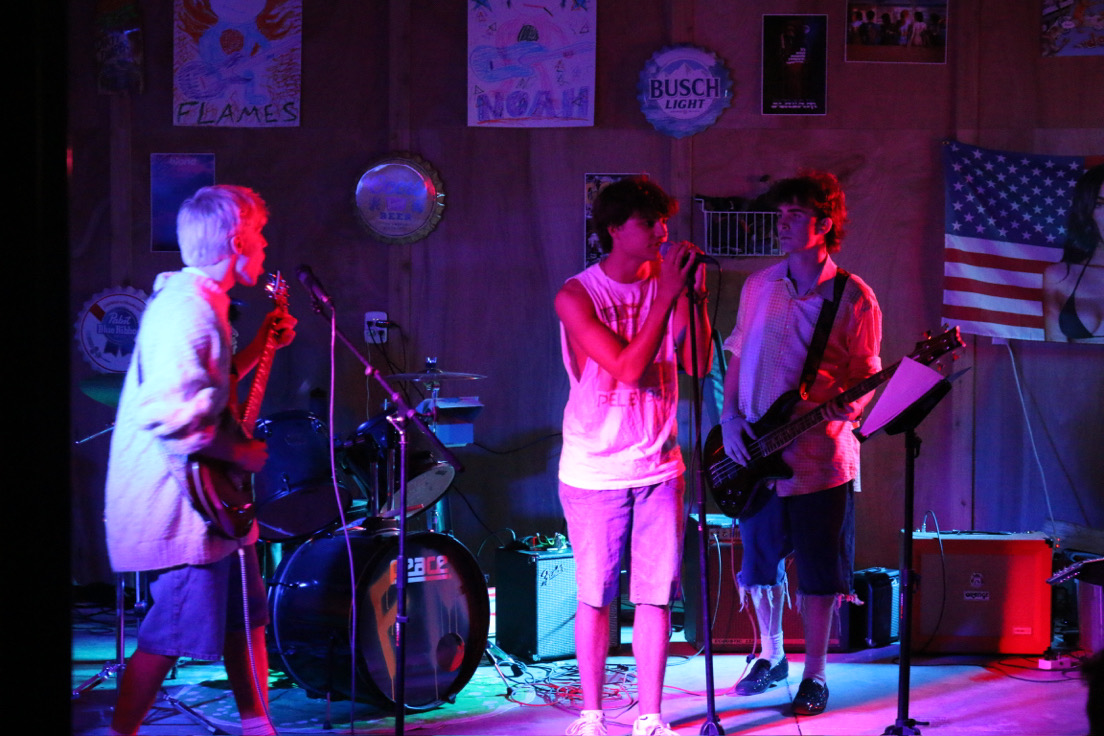 Guitarists Peter Stys (left) and James Heiman (right) play the bassline while Braxon Boyd (middle) sings. 
Used with permission by Peter Stys 