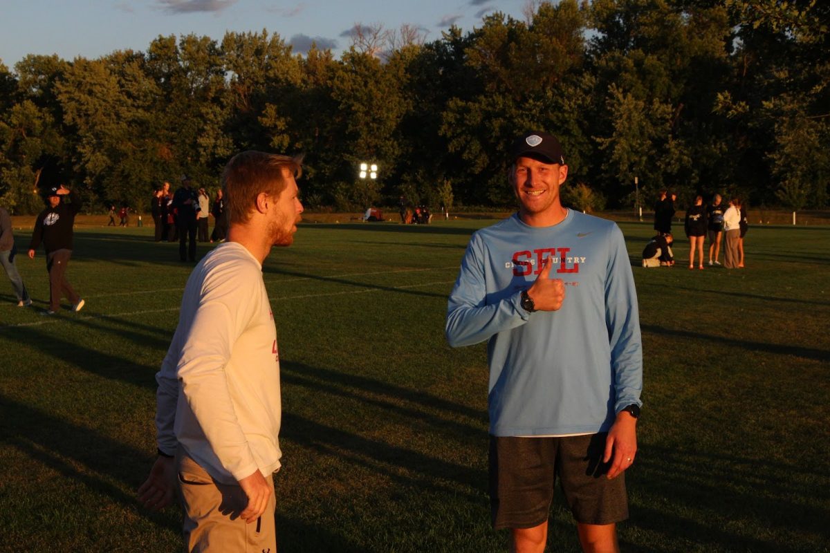 LHS head Cross Country and Long Distance Track Coach, Luke Jelen, poses for the camera during golden hour.