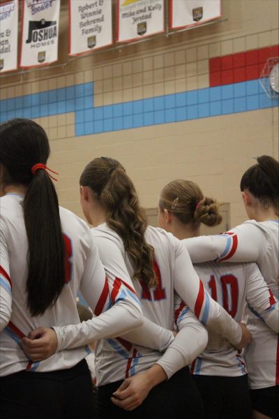 Team huddle getting ready to play for a chance to go to the 2025 state volleyball tournament.