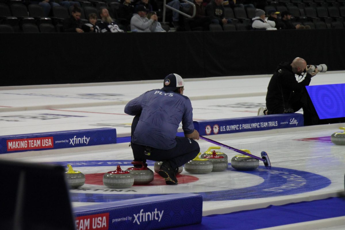 Chris Plys of team Shuster giving an aim point for his teammate in the finals versus Team Casper. 
