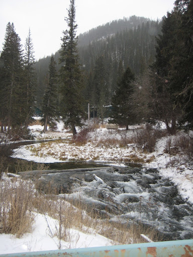 In Elmore, SD, while passing over a bridge, there is a waterfall flowing underneath, providing a beautiful view.