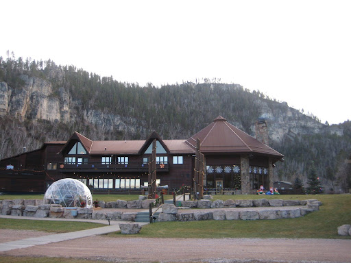 While driving in the canyon, Spearfish Canyon Lodge is visible at the top of a hill, providing warm rooms for tourists.
