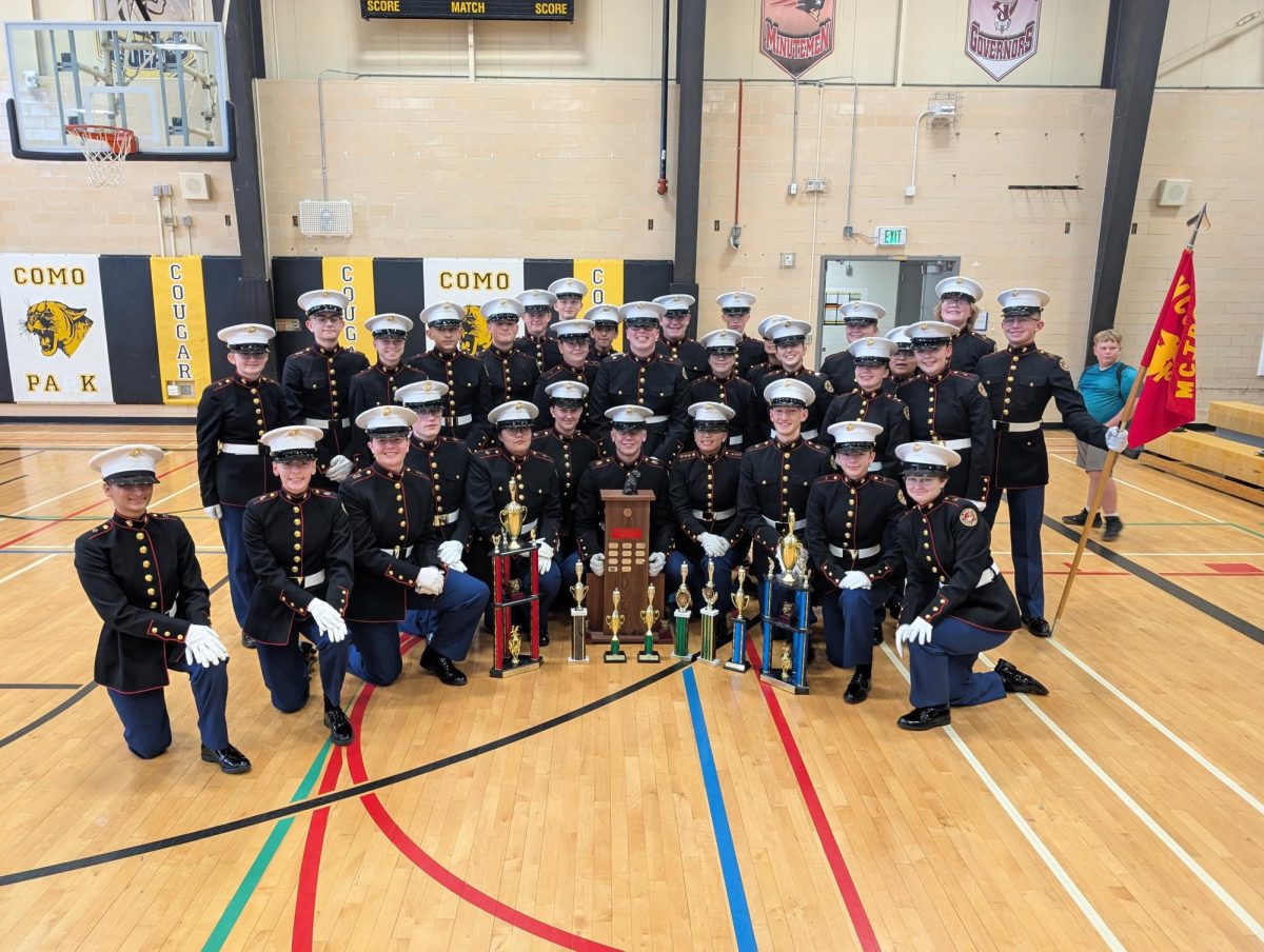 The Armed and un-Armed Drill team posing with the championship trophy from Como Park High School in St. Paul, MN (Photo used with permission by Nicole Kurkierewicz).