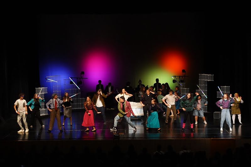 During the song “Christmas Electricity,” Scrooge's nephew Fred, played by LHS senior Josh Raether, has a party at his house on Christmas Eve (Photo used with permission by Flickr.com/ SDPB Landon DeBoer).