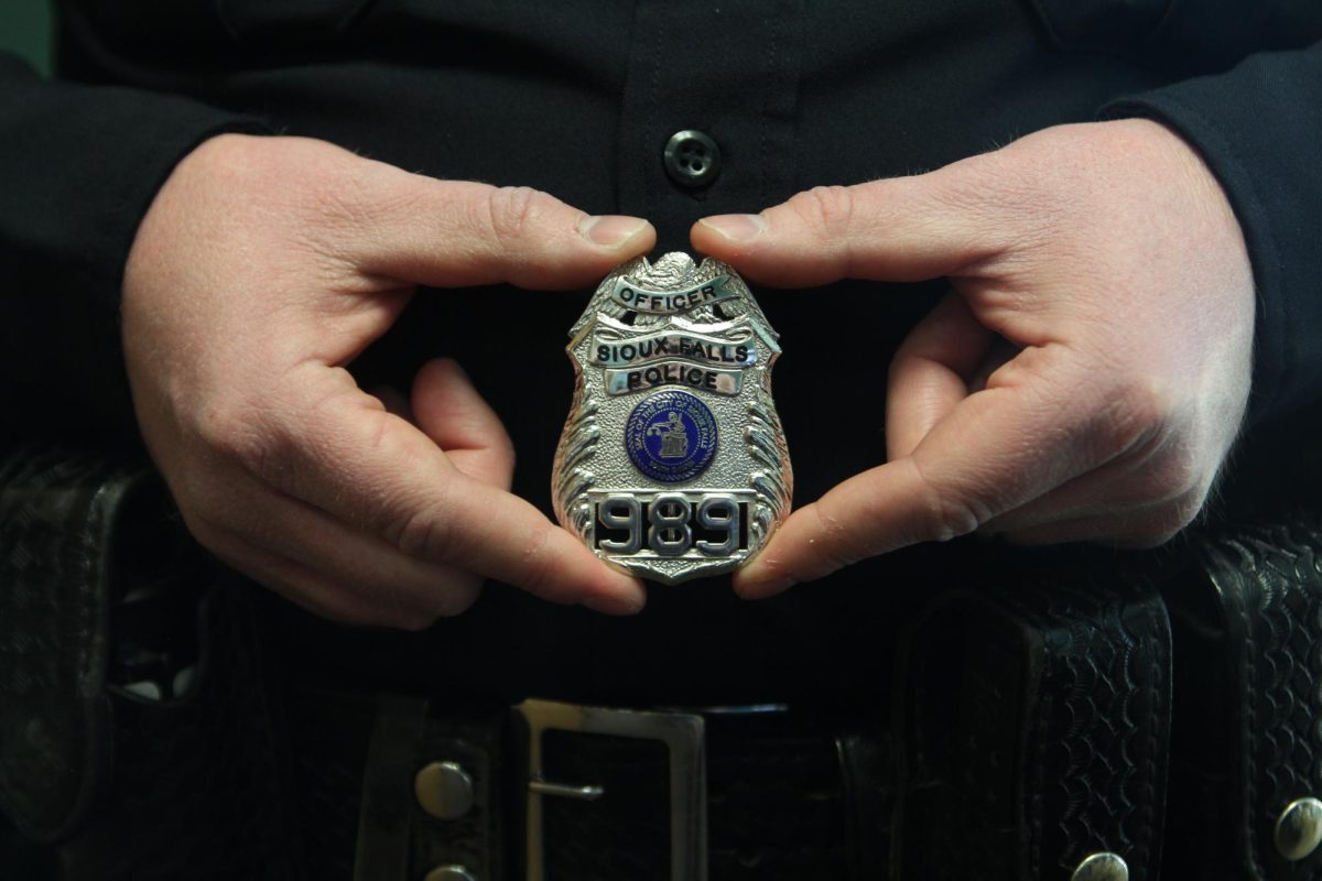 Chernock shows off his gleaming badge, eager to make his mark in the halls of LHS.
