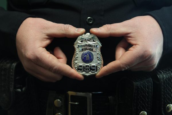Chernock shows off his gleaming badge, eager to make his mark in the halls of LHS.